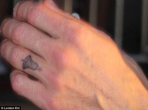 Dax Shepard debuts Kristen Bell tattoo at This Is Where I Leave ... Small Bell Tattoo, Bell Tattoo Ideas Simple, Bell Tattoo Ideas, Bells Tattoo, Amber Tattoo, Bell Tattoo, Tattoo On Finger, Patchwork Tattoos, Sister Tattoo Ideas