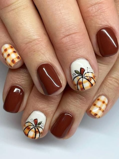 Transform your nails into works of art with our exquisite Fall Nail Art Designs! 🍂✨ Embrace the enchanting beauty of autumn with a stunning array of colors, patterns, and styles that will elevate your manicure game. From cozy sweater-inspired designs to elegant fall foliage, these nail art ideas capture the essence of the season. Explore the warmth of rich hues, playful accents, #FallNailArt #AutumnElegance #NailDesignInspiration 🍂✨ Fall Nails Scarecrow, Fall Plaid Pumpkin Nails, Fall Nails Ideas Autumn Plaid, Pumpkin Plaid Nails, Thanksgiving Plaid Nails, Plaid Pumpkin Nails, August Gel Nails Ideas, Pumpkin Gel Nails, Nails With Pumpkin Design