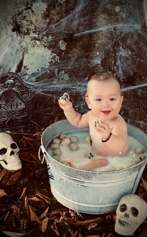 Milk bath with skulls Halloween Milk Bath Baby, Halloween Infant Pictures, Friday The 13th Photoshoot Ideas, Spooky Milk Bath, Spooky Baby Photoshoot, Halloween Milk Bath, Pumpkin Milk Bath, Baby Halloween Photoshoot, Newborn Sibling Pictures