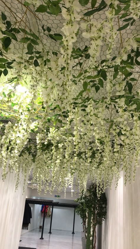 Leaf Ceiling Decor, Room With Vines And Led Lights Ceiling, Fake Flowers Hanging From Ceiling Bedroom, Flower Garland Bedroom Ceiling, Faux Plant Ceiling, Plant Ceiling Decor Bedroom, Fake Plant Ceiling, Diy Flower Ceiling, Vines Hanging From Ceiling