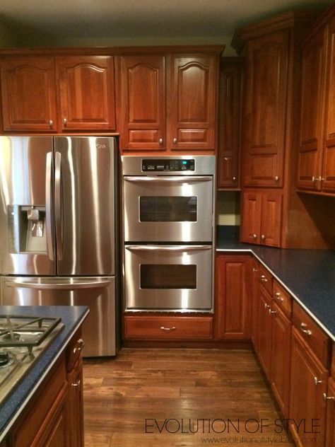 An Epic Painted Kitchen Cabinet Transformation - Evolution of Style Cherry Wood Kitchen Cabinets, Cherry Wood Kitchens, Redo Kitchen Cabinets, Cherry Wood Cabinets, Cabinet Transformations, Redo Cabinets, Corian Countertops, Colonial Kitchen, Cherry Kitchen