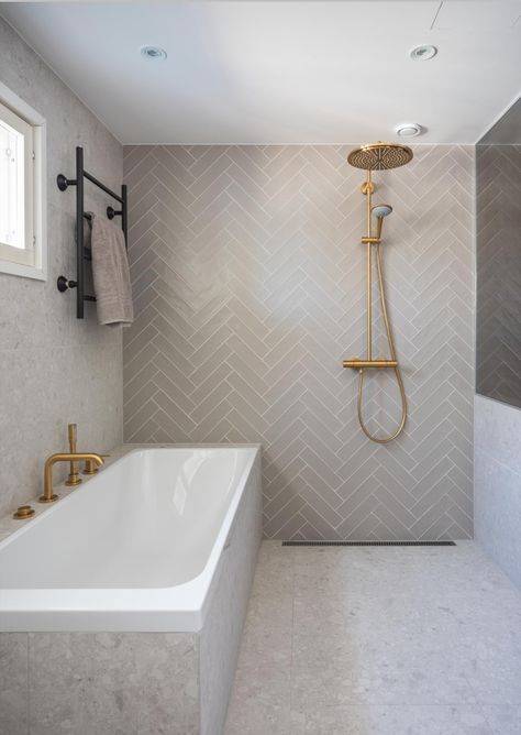 Fishbone Bathroom Tiles, Herringbone Feature Wall Bathroom, Herringbone Tiles Bathroom, Neutral Herringbone Tile Bathroom, Bathroom Fishbone Tiles, Large Tile Herringbone Shower Wall, Bathroom Tiles 2024, Herringbone Tile Bathroom Tilebar, Chevron Shower Tile