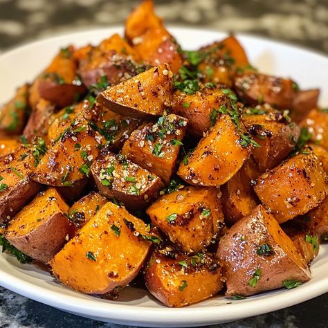 Cinnamon Maple Roasted Sweet Potatoes 🍠🍁 Ingredients: 4 medium sweet potatoes, peeled and cut into 1-inch cubes 3 tbsp olive oil 1/4 cup pure maple syrup 1 tsp ground cinnamon 1/4 tsp ground nutmeg 1/4 tsp salt 1/4 tsp black pepper 1 tbsp chopped fresh parsley (optional, for garnish) Instructions: Preheat the oven to 400°F (200°C). Line a large baking sheet with parchment paper. Prepare the sweet potatoes: In a large mixing bowl, toss the sweet potato cubes with olive oil, maple syrup, cinnam... Sweet Potato Aesthetic, Sweet Potato Roasted, Sweet Potato Cubes, Potato Cubes, Roasted Sweet Potato, Baked Sweet Potato, Ground Nutmeg, Pure Maple Syrup, Roasted Sweet Potatoes