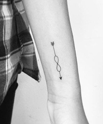 19 Best Arrow Tattoo Ideas to Inspire Your Next Ink Wrist Arrow Tattoos For Women, Infinity Arrow Tattoos For Women, 4 Better 4 Worse 4 Life Tattoo, Small Arrow Tattoos For Women, Arrow Finger Tattoo, Arrow Tattoo Ideas, Infinity Arrow Tattoo, Archery Tattoo, Simple Arrow Tattoo