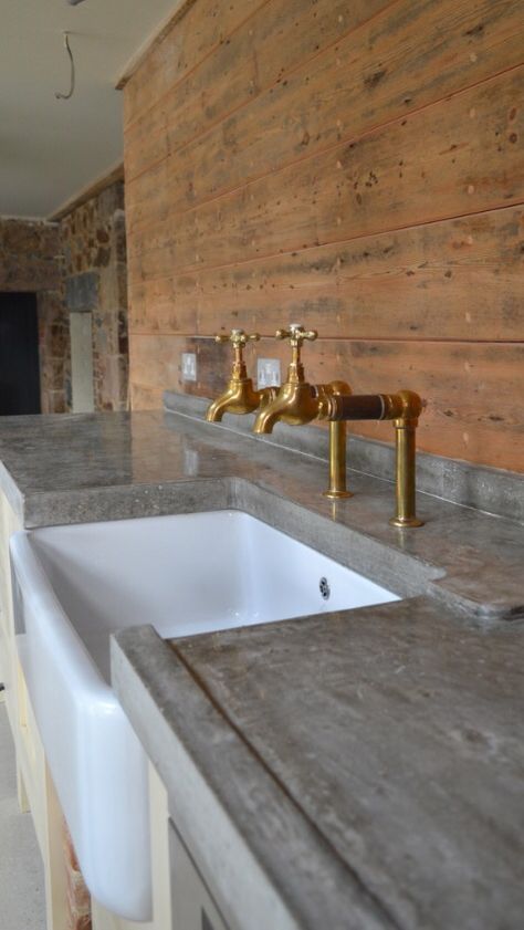 Love the brass taps and grey worktop - poss concrete? Concrete Kitchens, Rustic Countertops, Kitchen Counter Top, Outdoor Kitchen Countertops, Concrete Bench, Concrete Kitchen, Concrete Wood, Polished Concrete, Concrete Countertops