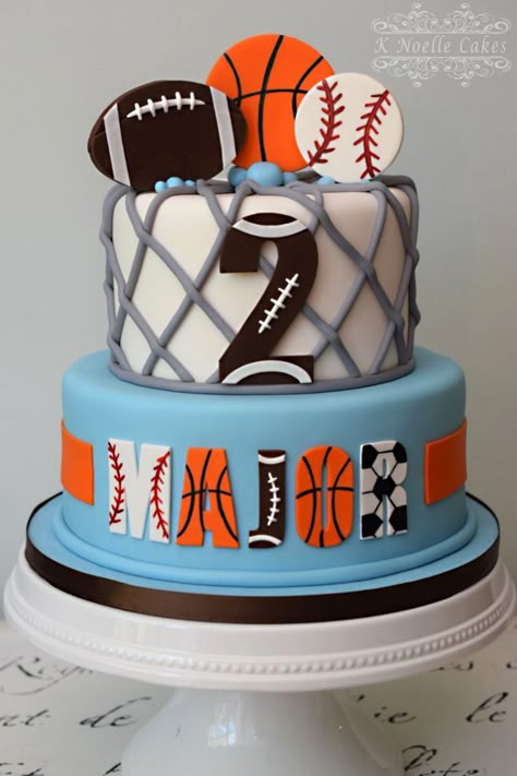 Sports theme 2nd birthday cake by K Noelle Cakes All Sports Theme Cake, Sports Themed 2nd Birthday Party Ideas, Second Birthday Sports Theme, All Sports Birthday Cake, Sports Themed Birthday Cakes For Boys, Ball Theme Cake 2nd Birthday, Two Year Old Sports Birthday Party, Sports Theme Cakes Boys, Sports Birthday Cakes For Boys