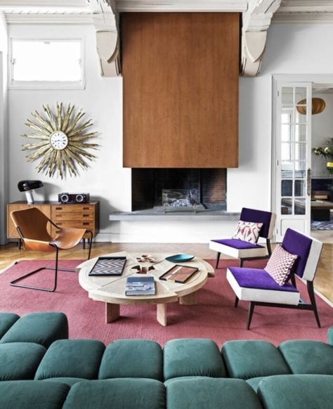 This space is designed with some asymetrical balance. The color of the chairs on the right really pops and draws attention but the gold decoration on the wall on the left helps to balance this. Maximalist Interior, Serene Bathroom, Paris Home, Design Salon, A Living Room, House And Home Magazine, Elegant Decor, Elle Decor, My New Room