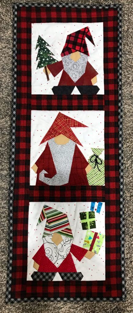 I am always asking my customers to send photos of the things they create using my patterns. Today I am sharing some of my favorite photos. This adorable wall hanging was sewn by Carol Cheesman using LUMBERJACK GNOME, SANTA GNOME, and GNOME WITH GIFTS. Elise Brasseale made these cute little mug rugs using the elf … Continue reading Some Holiday Projects → The post Some Holiday Projects appeared first on Made By Marney. Quilted Gnomes, Gnome Paper Piecing, Gnome Wall Hanging, Christmas Gnome Quilt Patterns Free, Gnome Quilt Block Free Pattern, Gnome Quilt Block, Christmas Wall Hangings Quilted, Gnome Quilts, Gnome Quilt