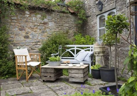 Small Front Porch Seating, Garden With Seating Area, Potted Evergreens, Garden With Seating, Front Porch Seating Ideas, Seating Area Design, Small Courtyard Garden, Stone Courtyard, Scented Plants