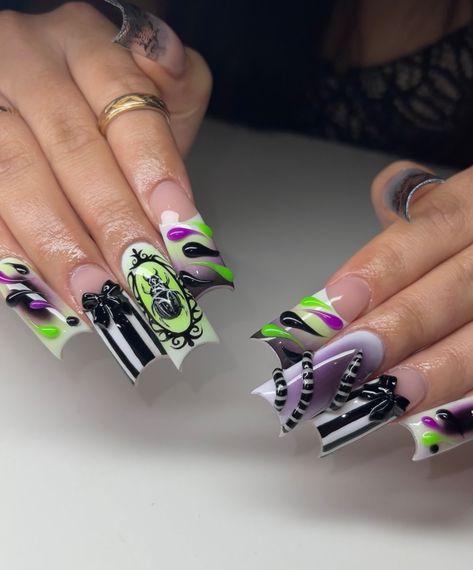 Beetlejuice freestyle pt 2🪲 • Check out pt1 bts 🎬@ash_doesnailz • Products used: @dimenailsupply.2 Cover Barely (use code ASH10) @dndgel French white Licorice black Matte & no cleanse top coat No cleanse Rhinestone gel @bornprettyofficial Milky white non stick 3d gel (use code ASHDOESNAILZ) @glamandglits Green & purple pigment powder @opi_professionals @opi Black onyx pigment #beetlejuice #beetlejuicenails #beetlegeuse #timburton #timburtonnails #spookynails #halloweennails #fal... Beetlejuice Nail Designs, Beetle Juice Nails, Spooky Sets, Beetlejuice Nails, Opi Black, Beetlejuice Makeup, Beetlejuice Costume, Halloween Acrylic, Long Square Nails