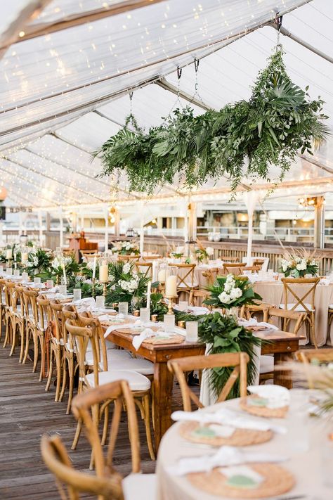 Clear Tent Wedding, Wedding Tent Hanging Greenery, Wedding Reception Clear Tent, Clear Top Tent Wedding, Clear Tent Wedding Reception Lighting, Clear Reception Tent, Hanging Flowers Wedding, Farm Table Wedding, Waterfront Wedding Ceremony