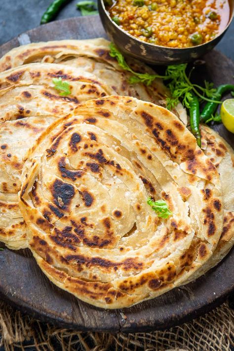 Lachha Paratha is a layered flaky Indian bread which is great to pair with curries. Learn how to make  it at home using my easy recipe. Lachha Paratha Recipe, Asian Feast, Lachha Paratha, Baking Bad, Curry Night, Fried Bread, Indian Flat Bread, Food Van, Paratha Recipe