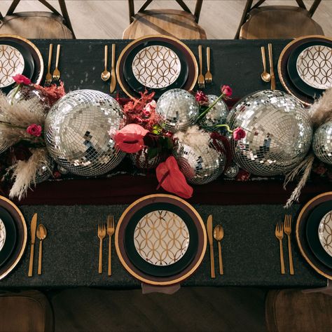 Sequin Tablecloth Wedding Tablespace with a Disco Ball Custom Centerpiece, Gold Cutlery, Gold Charger Plates, and Cross Back Chairs. Disco Themed Table Decor, Disco Ball Centrepiece, Disco Centerpieces Wedding, Disco Party Table Setting, Disco Balls Wedding Decor, Retro Table Decor, Cross Back Chairs Wedding, Ball Table Decorations, Disco Ball Table Decor