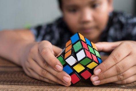 Asian boy playing with rubik`s cube.boy solving puzzle. Brainstorming and brain #Sponsored , #Paid, #AD, #playing, #Asian, #Brainstorming, #rubik Solve Rubix Cube Easy, Rubix Cube Picture, How To Slove A 4 By 4 Rubix Cube, Rubik’s Cube, Gan Rubiks Cube, Asian Boy, Brain Teaser, Boys Playing, Page Facebook