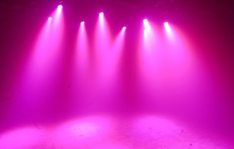 COLOR: I love this shade of pink and think that it does a great job at showing color in terms of stage lighting and really lights up the whole stage. Colorful Stage Background, Theatre Lighting Aesthetic, Pink Lighting Aesthetic, Pink Stage Lighting, Pink Stage Design, Pink Stage Background, Stage Lights Aesthetic, Spotlight Wallpaper, Tracy Turnblad