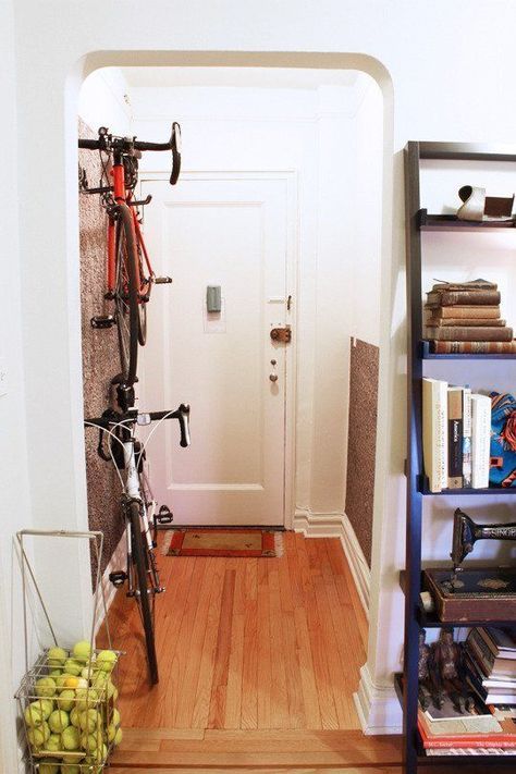 Keep bikes out of the way: Those big, clunky things might be necessary for your morning commute or exercise routine, but storage is an issue if you don't have a garage — until you install vertical hangers so you can arrange them on an unused hallway wall. Small Apartment Bike Storage, Apartment Bike Storage, Bike Storage Ideas, Bike Storage Apartment, Pallet Deck Diy, Indoor Bike Storage, Bike Storage Solutions, Bike Storage Rack, Bike Wall