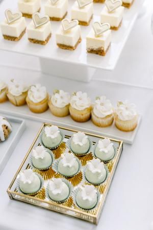 A Trio Of Garden-Inspired Ceremony Arches Wows At This Toronto Wedding Wedding Mini Cupcakes, Engagement Party Dessert Table, Wedding Cupcake Table, Sweet Catering, Presley Wedding, Mini Dessert Shooters, White Dessert Tables, Ceremony Arches, Sweet Table Wedding