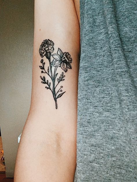 Carnation and daffodil botanical tattoo Floral Bicep Tattoo, Carnation Tattoo, Daffodil Tattoo, Candle Tattoo, Watercolor Tattoo Flower, Single Needle Tattoo, Flower Tattoo Shoulder, Bicep Tattoo, Botanical Tattoo