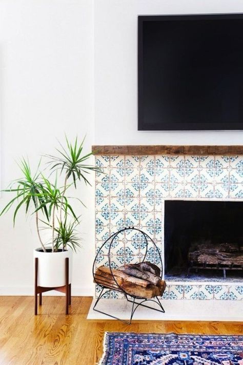 11 Encaustic Tile Ideas You *Need* in Your Home This Year - Brit + Co Cement Tile Fireplace, Design Camino, Fireplace Tile Surround, Interior Design Per La Casa, Rustic Fireplaces, Fireplace Remodel, Amber Interiors, Home Fireplace, Fireplace Makeover