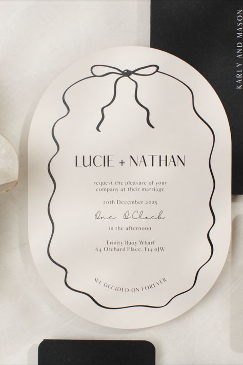 A modern wedding invitation is displayed, featuring a double arch design with a hand-drawn squiggly border and a bow. The invitation has an almond tone and is adorned with a bow, exuding a modern and stylish aesthetic. It's described as on-trend and designed by papergrace.co.uk Scribble Wedding Invitation, Elegant Stationery Design, Wedding Menu With Bow, Bow Wedding Invitations, Simple Wedding Invite, Modern Stationary Design, Cool Wedding Invitations, Wedding Invite Ideas, Wedding Stationary Design