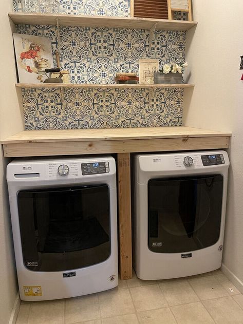 Remember when I did a makeover on my laundry nook? You can find all the details on my blog. Well I told you at that time that I planned to build a countertop over the washer and dryer to make a nice folding surface and some place to hold the detergent within reach.An added bonus is that it keeps things from falling between and behind the machines which was a constant problem.For a few reasons I never got around to building the counter and then a couple weeks ago my dryer died and my wa… Front Loading Washer And Dryer With Counter, Diy Raised Washer And Dryer, Washing Machine Table Top, Waterfall Washer Dryer Countertop, Washing Machine Wooden Cover, Over Washer Storage, Tabletop Over Washer And Dryer, Curtain Behind Washer And Dryer, Laundry Room Built Ins Washer And Dryer