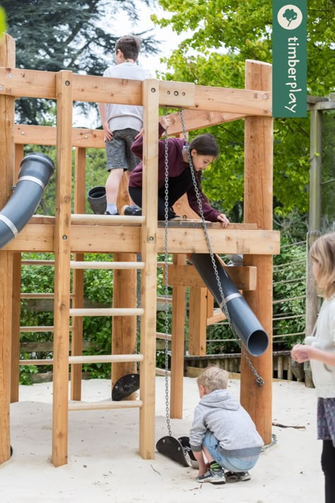 Bring the excitement of construction to your children's playground design with Building Sites! Kids will love mimicking the adult working world and performing tasks like moving heavy loads, pouring sand and water, turning a sand wheel, and using a dumper box and bucket. This wooden playground encourages teamwork and allows kids to experiment with physical laws in a fun and engaging way. Place the hut playground on a sand or gravel surface for optimal play value. Sand Playground, Sand Pits For Kids, Playground Sand, Wood Playground, Playgrounds Architecture, Playground Kids, Sand House, Wooden Playground, Climbing Tower