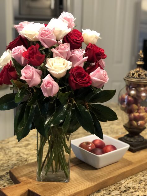 Red, white, pink roses with magnolia leaves Pink Red White Flower Arrangement, Quince Centerpieces, Rose Centerpieces Wedding, White Pink Roses, Fresh Flower Market, White Flower Arrangements, Fresh Cut Roses, Ruby Anniversary, White And Pink Roses