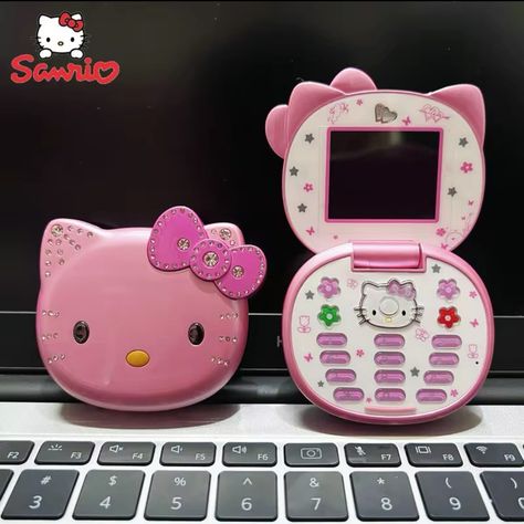 COMING SOON!! Our newest edition, the new Sanrio Hello Kitty flip phones, available in two fun colors: pink and white. These phones blend nostalgic charm with modern features, making them a perfect accessory for any Hello Kitty fan. Get yours today and stay connected in style!🪷💖😸 #sanrio #hellokitty #hellokitty #hellyeah #insta #reel #earthfocus Cute Flip Phones, Alt Hello Kitty, Hello Kitty Flip Phone, Insta Reel, Mini Phone, Pumpkin Patch Outfit, Birthday Fashion, Flip Phone, Flip Phones