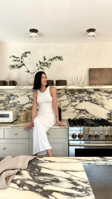 So, I saw all your questions about the difference in thickness of my marble counter and shelves in my Amagansett kitchen…and decided it was… | Instagram Marble Counters Kitchen, Cb2 Kitchen, Concrete And Marble Kitchen, Kitchen With Marble Shelf, Marble Shelf In Kitchen, Marble Island Kitchen, Marble Shelves, Floating Marble Shelf Kitchen, Curved Marble Kitchen Island