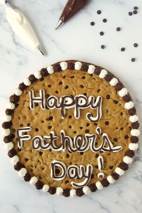 There's no better way to celebrate your dad than with a giant Father's Day Chocolate Chip Cookie Cake. This soft, chewy brown sugar cookie is loaded with decadent chocolate chips and is fun to decorate for Father's day, a birthday, or any special occasion. Easter Dessert Table, Sandwich Cookies Filling, Skillet Cookies, Giant Chocolate Chip Cookie, Marshmallow Frosting, Chocolate Chip Cookie Cake, Cookie Cakes, Giant Chocolate, Giant Cookie