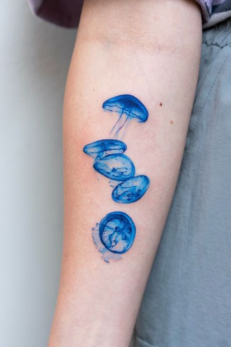 Discover the art of transformation with jellyfish tattoos in our article. Explore it and find 50+ stylish designs with meanings explained. Blue Ink Tattoos, Iphone Pic, Ray Tattoo, 16 Tattoo, Funky Tattoos, Jellyfish Tattoo, Cute Little Tattoos, Cute Tiny Tattoos, Cover Up Tattoos