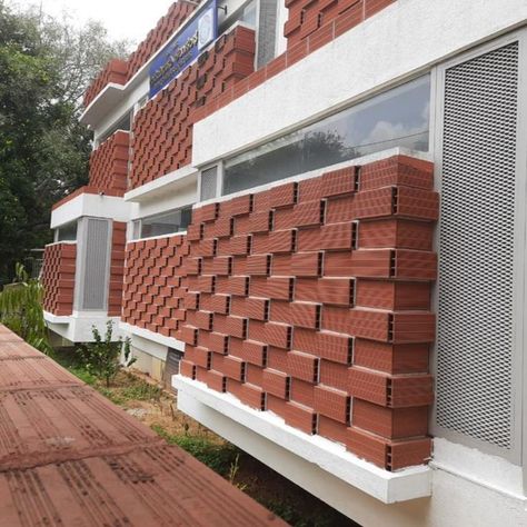 A shining example of a unique and modern design! This eye-catching project has innovatively used Porotherm Smart Bricks on its facade, which is artistic yet sustainable. Planning to get Porotherm Smart Bricks for your home? Visit https://www.wienerberger.in/references/Porotherm.html and explore its benefits. . . #Wienerberger #WienerbergerIndia #energyefficient #wallsolution #bricks #smartbricks #porothermbricks #clay #innovation #architects #construction #natural #SustainableArchitecture Porotherm Brick House, Boundry Wall, Brick Houses, Brick Cladding, Brick Art, Rammed Earth, Brick Architecture, Brick Facade, Brick Patterns