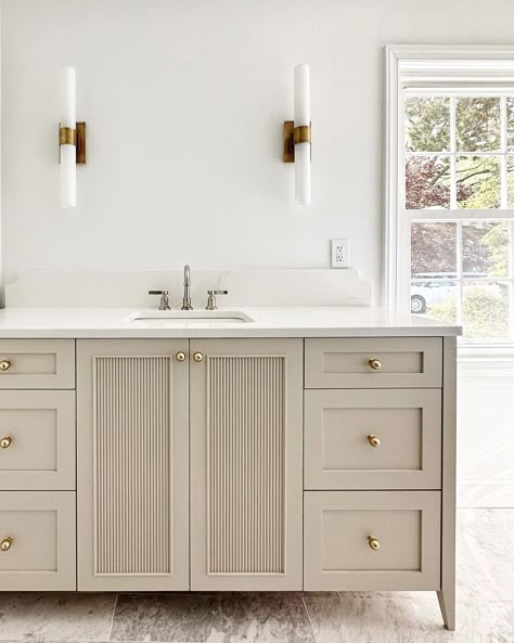 Oak + marble + brass always • #throwback to the installation of her vanity at #16libbie • Design: @maureenmagula_design #tbt #bathroom… | Instagram Putty Bathroom Cabinets, Fluted Vanity Cabinet, Pure Salt Interiors Bathroom, Taupe Bathroom Cabinets, Taupe Bathroom Vanity, Custom Vanity Cabinets, Painted Bathroom Vanity, Taupe Bathroom, Powder Room Vanity