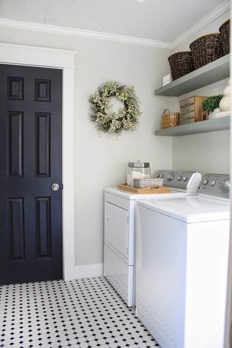 Gorgeous Neutral Laundry Room... love the black door and craftsman style casing, floating shelves, baskets, love love love! Room Tiles Design, Laundry Room Tile, Laundry Room Colors, Farmhouse Laundry Room, Laundry Room Inspiration, Room Tiles, Black Door, Small Laundry Room, Small Laundry