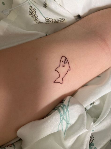 Shark Aesthetic Tattoo, Shark Tiny Tattoo, Tiny Shark Tattoo Simple, Shark And Dinosaur Tattoo, Silly Shark Tattoo, Minimalistic Shark Tattoo, Simple Silly Tattoos, Funny Shark Tattoo, Shark Fine Line Tattoo