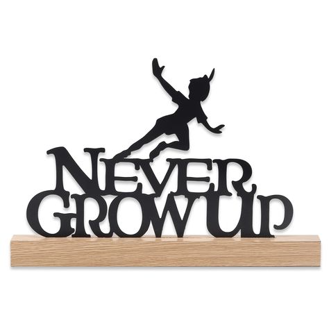 PRICES MAY VARY. Disney Peter Pan official product: Peter Pan is a favorite among the young and the young-at-heart. This whimsical decor is a sweet callback to the classic film, boasting a neutral black and natural color scheme that's sure to coordinate with any decor. Fun Tabletop Decor: Featuring a flying Peter Pan silhouette atop the words, "Never Grow Up," this piece is sure to remind you never to lose your childlike qualities. Material: This die-cut decor is made of metal with a durable, ye Peter Pan Silhouette, Movie Ideas, Playful Decor, Never Grow Up, Whimsical Decor, Movie Room, Tabletop Decor, Christmas Movie, Room Size