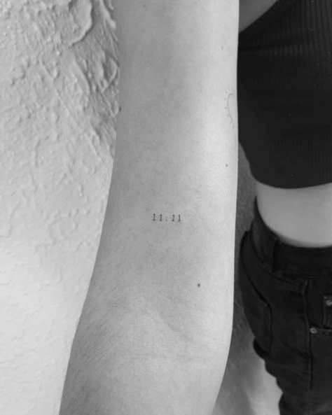 "11:11" lettering tattoo on the bicep. Tiny 11:11 Tattoo, 1111 Tattoo Placement, Fine Line Time Tattoo, 11 11 Tattoo Finger, 11:11 Fine Line Tattoo, Dainty 11:11 Tattoo, Red 11 11 Tattoo, 11 11 Wrist Tattoo, 11 11 Tattoo Placement