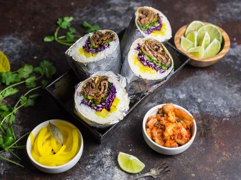 These beef bulgogi burritos are a fusion dish, combining the essentials of traditional Korean bulgogi in a delicious wrapped burrito. Loaded with flavorful add-ins, like kimchi and pickled daikon radish, they're a winner for the mouth and the eyes. Pickled Daikon Radish, Korean Mexican, Beef Bulgogi Recipe, Korean Beef Bulgogi, Pickled Daikon, Korean Bulgogi, Greek Diet, Fancy Dinners, Bulgogi Recipe