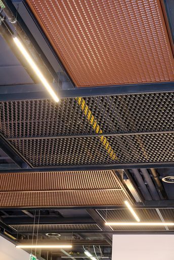 Industrial Style Ceiling Design, Stretch Metal Ceiling, Metal Ceiling Design, Perforated Metal Ceiling, Industrial Basement Ideas, Metal Panel Ceiling, Metal Interior Design, Gym Design Interior, Office Ceiling