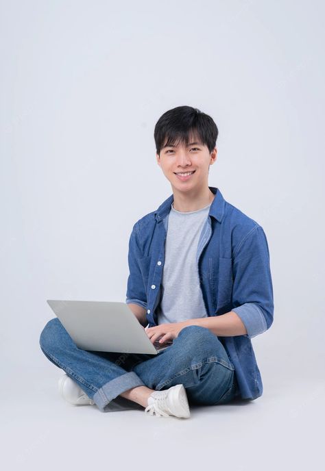 Premium Photo | Young asian man sitting and using laptop on white background Sitting In Desk Reference, Male Office, Pose Photography, Face Swap, Smart Boy, Asian Man, Element Design, Draw The Squad, Image Memes