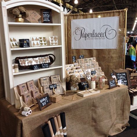 I love how the entire booth is pulled together with the burlap. This is a good example of using height to display product. Craft Fair Booth Ideas, Fair Booth Ideas, Booth Display Ideas Diy, Craft Fair Booth, Craft Stall Display, Vendor Booth Display, Craft Fair Booth Display, Vendor Table, Craft Show Booths