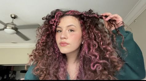 Pink hair with brown highlights balayage Brown Hair Pink Highlights Curly, Pink Brown Curly Hair, Curly Brown Hair With Pink Highlights, Color Highlights Curly Hair, Pink Highlights In Brown Hair Curls, Pink Highlights In Brown Curly Hair, Curly Pink Highlights, Brown Hair Peekaboo, Curly Hair Pink Highlights