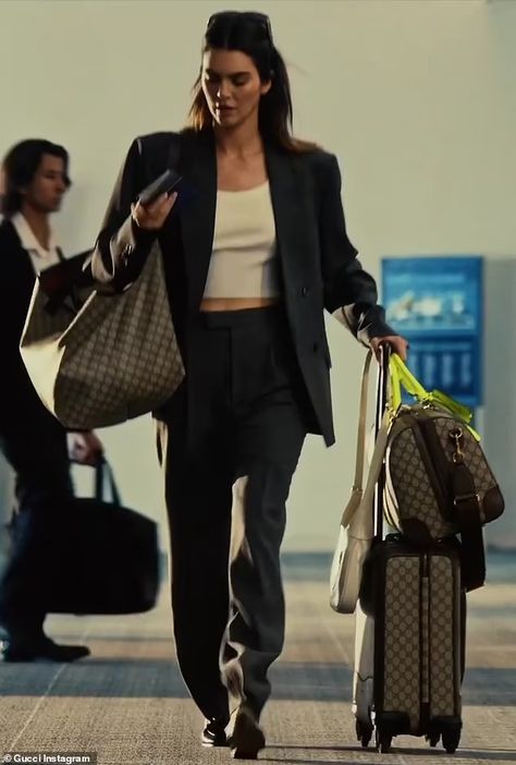 Kendall Jenner's fans TROLL her Gucci commercial where she drags her luggage through a commercial airport: 'She only flies private with handlers!' | Daily Mail Online Fancy Airport Outfits, Kendall Airport Style, Kendall Jenner Bags, Gucci Commercial, Kendall Jenner Airport Style, Kendall Jenner Airport, Airport Bag, Rich And Classy, Private Airport