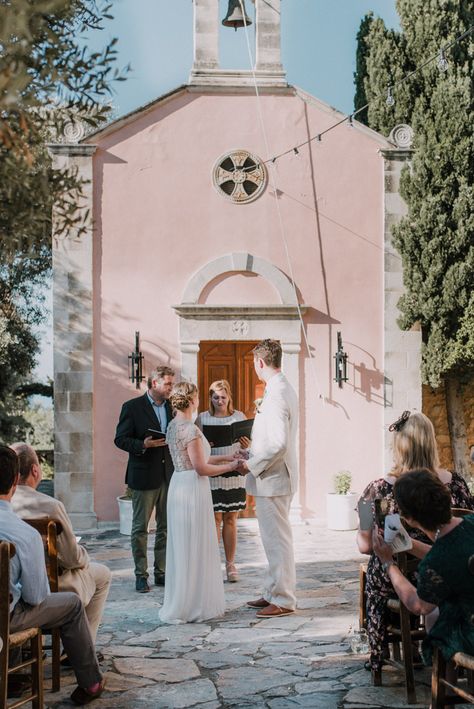 Wedding Ceremony | Bride in Catherine Deane Gown | Groom in Beige Austin Reed Suit | Outdoor Pastel Destination Wedding at Agreco in Greece | Best Moments Wedding Planner | Paulina Weddings Photography Romantic Outdoor Wedding Ceremony, Pink Flower Decor, Catherine Deane Bridal, Outdoor Evening Wedding, Fall Ceremony, Wedding Church Decor, Summer Wedding Ceremony, Destination Wedding Favors, Destination Wedding Welcome Bag