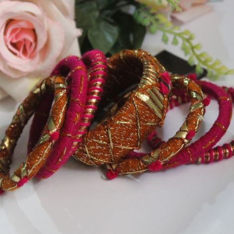 Elevate your accessory game with our exquisite handmade Gotta Bangles, featuring a stunning blend of rich brown and soft pink hues. Each bangle is intricately crafted with delicate thread work and embellished with charming mirror detailing, adding a touch of sparkle and elegance. Perfect for any occasion, these bangles embody the spirit of tradition while making a bold fashion statement. Adorn your wrists with these unique pieces and let your style shine! #HandmadeJewelry #GottaBangles #Tradi... Thread Work, Bold Fashion, The Spirit, Soft Pink, Fashion Statement, Unique Pieces, Handmade Jewelry, Bangles, Thread