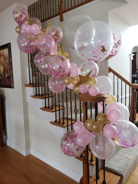 Using balloon garland tape and battery white Christmas lights created this delightful banister garland. Balloons On Banister, Balloon Banister, Banister Balloon Garland, Stair Railing Decorations Birthday Party, Balloon Garland Over Doorway, Staircase Balloon Garland, Garland Banister, Banister Garland, Baloon Garland