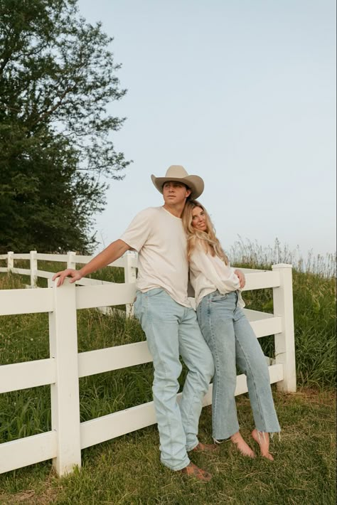 Engagement photo couple session cowboy hat engagement ring golf course wrangler jeans kissing sunset hugging photography white fence Couple Picture, Couples Shoot, Engagement Pics, Couple Photoshoot, Couples Photos, Couples Photoshoot, Engagement Shoot, Photoshoot Poses, Engagement Pictures