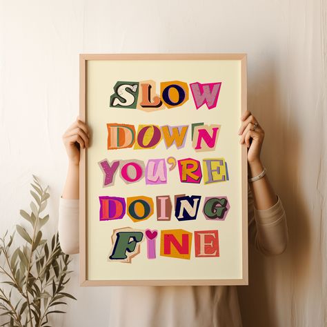 Brighten up your space with the "Slow Down You're Doing Fine" wall art featuring vibrant symbols made with recycled magazines. This trendy and aesthetic poster serves as a daily reminder with uplifting Billy Joel lyrics, making it the perfect affirmation wall art for any room. Let Billy Joel's quote inspire good vibes and bring a touch of positivity to your dorm or home. Add a splash of color and motivation to your walls with this unique art print that is sure to uplift your spirits every day. Y Billy Joel Poster, Billy Joel Lyrics, Colorful Magazine, Art Symbols, Recycled Magazines, Fine Print, Billy Joel, Trendy Wall Art, Wall Deco