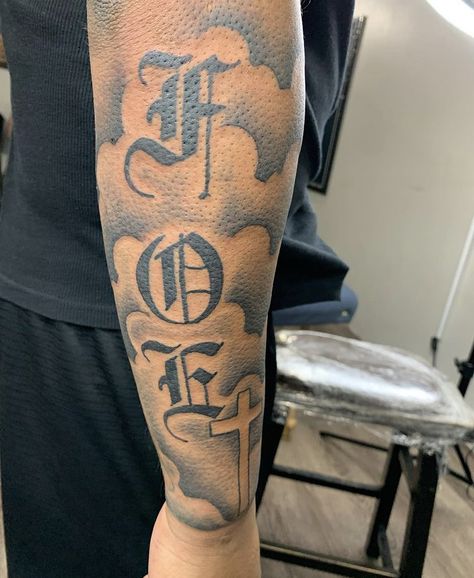 F.o.e Tattoo Men, Forearm Tattoos Lettering, Back Of The Bicep Tattoo, Cool Tattoos For Guys Sleeve, Medium Arm Tattoo Men, Foe Tattoos Men, Outter Arm Tattoo Men Sleeve, Foe Tattoos, Chosen 1 Tattoo Men