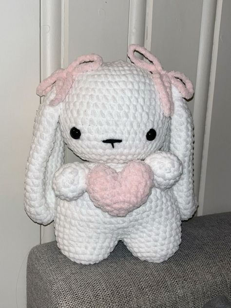 Download our free amigurumi patterns in PDF format and start crocheting your own adorable plushies today! Easy, fun, and oh-so-cute. 🧵📝 Crochet Pink Bunny, Crochet White Amigurumi, Pink Bunny Crochet, Pink And White Crochet Ideas, Bunny Holding Heart, Crochet Pink And White, Bunny Plushies, Pink And White Crochet, Easy Crochet Animals